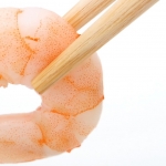 Shrimp being held by chopsticks